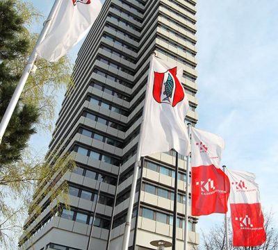 City Hall with red and white flags in the front
