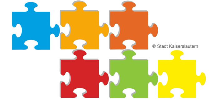Das Bild zeigt Puzzleteile in verschiedenen Farben.