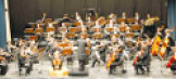 Ein klassisches Streichorchester auf der Bühne. © Stadt Kaiserslautern