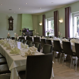 The restaurant with long tables decorated in spring colors.